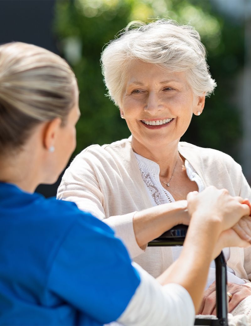 Home health care worker with elderly woman