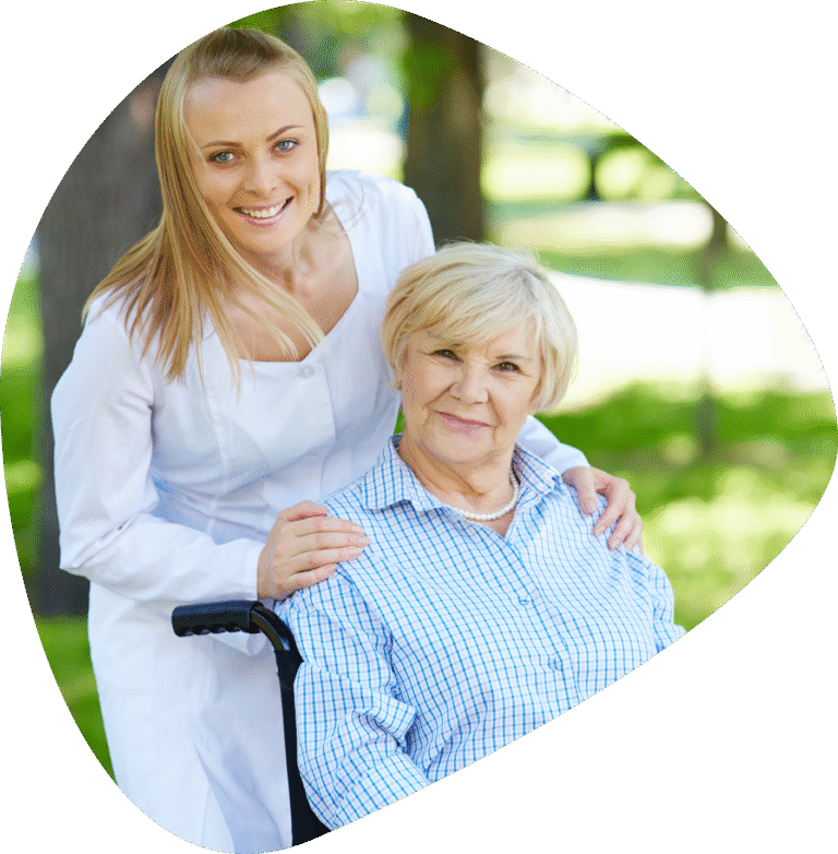 Smiling caregiver with senior woman in wheelchair receiving customizable home care services in Denver.
